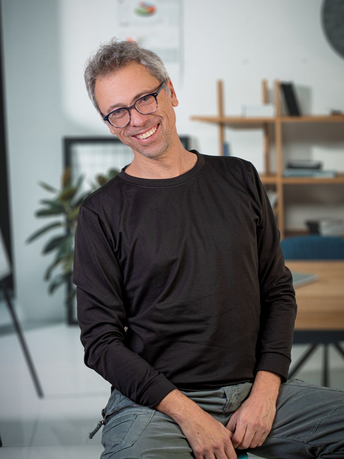 Moshe Dubman smiling in his office